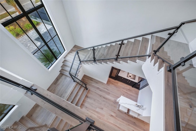 stairway with hardwood / wood-style flooring