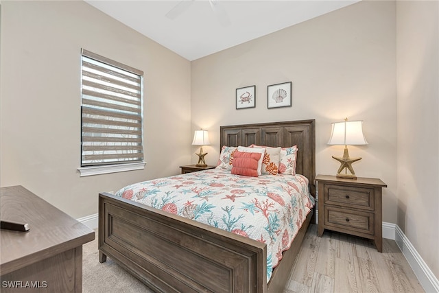 bedroom featuring light hardwood / wood-style floors and ceiling fan