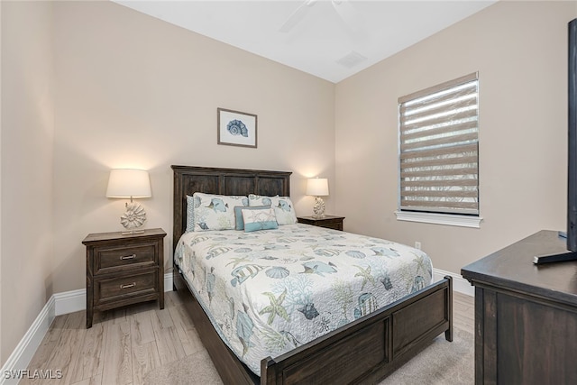 bedroom featuring light hardwood / wood-style floors and ceiling fan