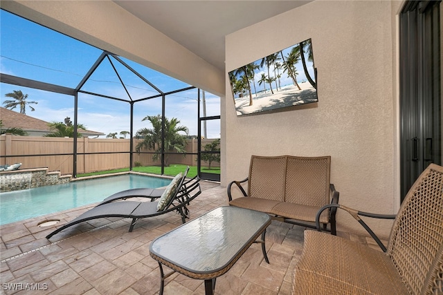 view of patio featuring pool water feature, a lanai, and a fenced in pool