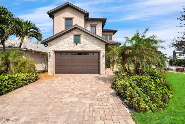 view of front facade featuring a front lawn and a garage