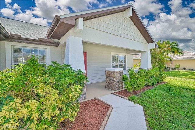 entrance to property with a yard