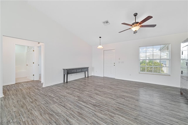 unfurnished living room featuring ceiling fan, high vaulted ceiling, and dark hardwood / wood-style flooring