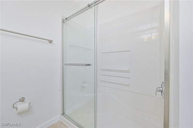 bathroom featuring an enclosed shower