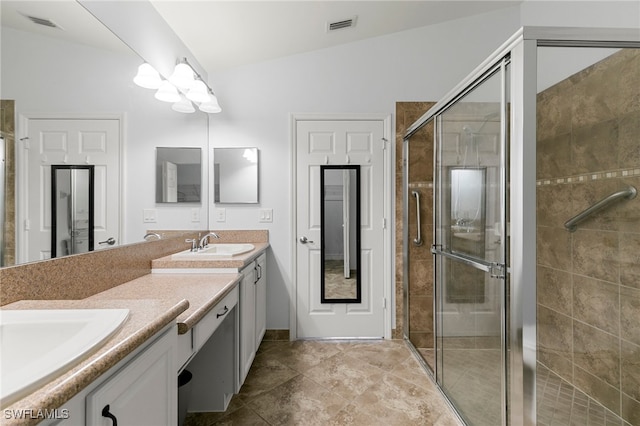 bathroom featuring a shower with door, vanity, and lofted ceiling