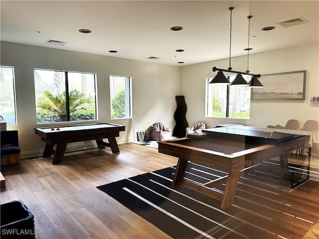 rec room with billiards and hardwood / wood-style flooring