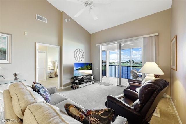 carpeted living room featuring ceiling fan and high vaulted ceiling