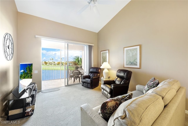 living room with carpet floors, high vaulted ceiling, and ceiling fan