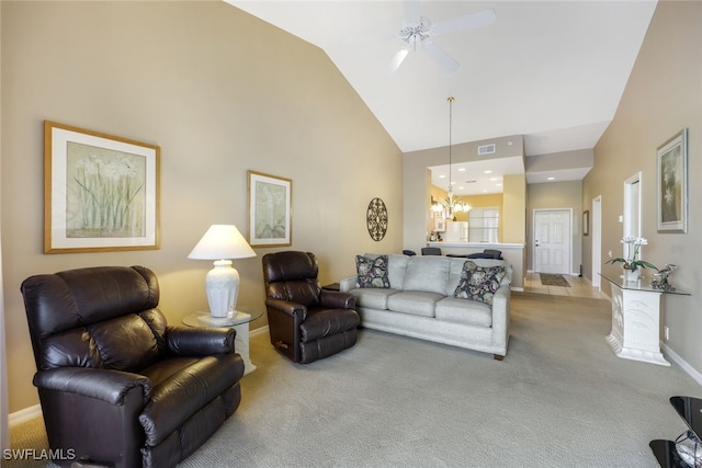 living room featuring carpet floors, high vaulted ceiling, and ceiling fan with notable chandelier