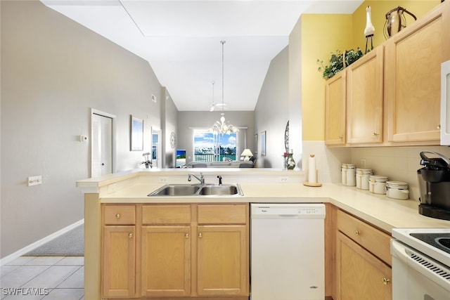 kitchen featuring lofted ceiling, dishwasher, kitchen peninsula, sink, and an inviting chandelier