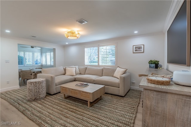 living room with ceiling fan, light hardwood / wood-style flooring, and ornamental molding