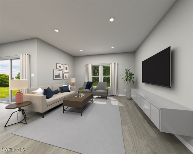 living room featuring light wood-type flooring and a wealth of natural light