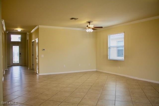 tiled spare room with crown molding and ceiling fan