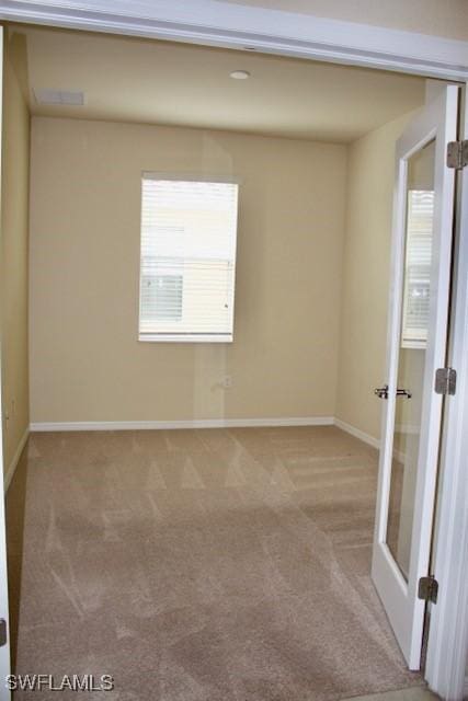 spare room with carpet flooring