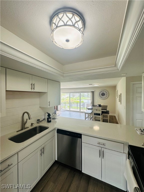 kitchen with dishwasher, sink, dark hardwood / wood-style floors, and white cabinets