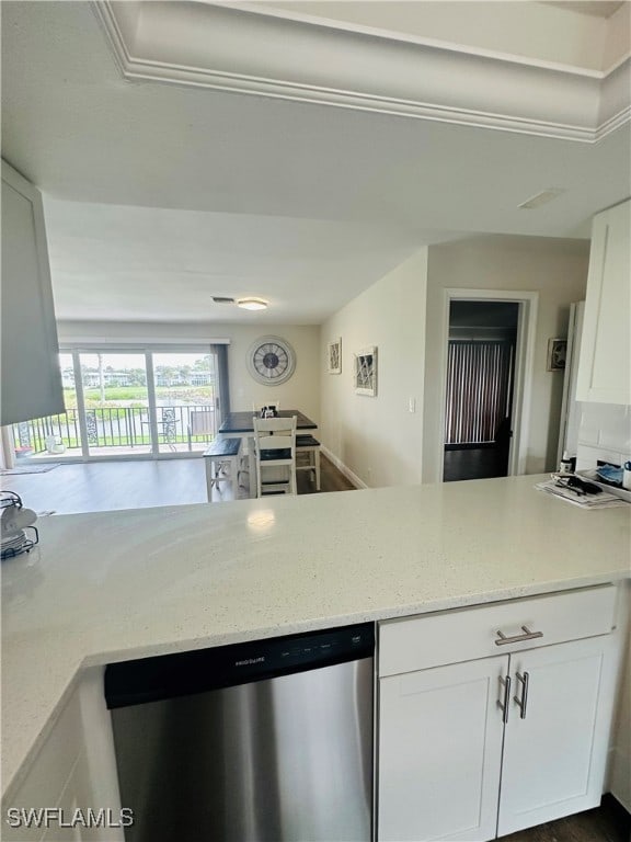 kitchen featuring stainless steel dishwasher, light stone countertops, dark hardwood / wood-style floors, and white cabinets