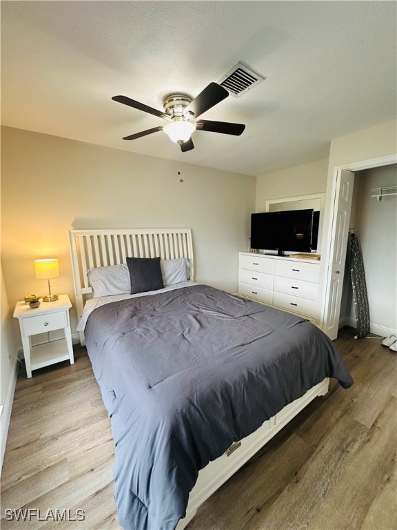 bedroom featuring ceiling fan and light hardwood / wood-style flooring