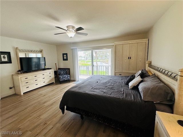 bedroom featuring light wood-type flooring, access to outside, and ceiling fan