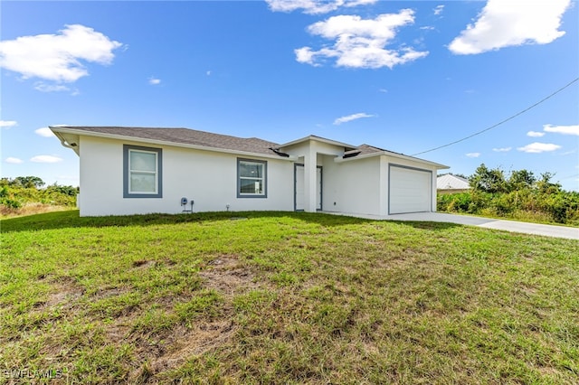 ranch-style home with a garage and a front lawn