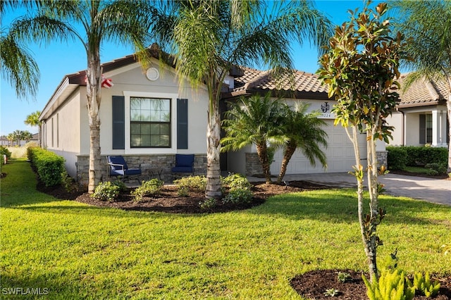 view of front of house with a garage and a front lawn