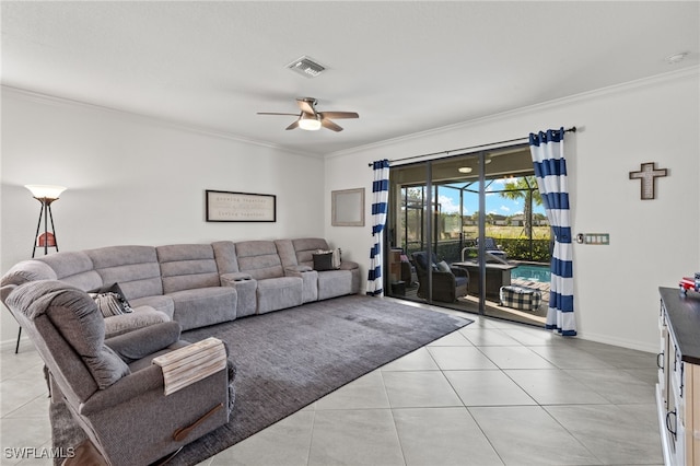 tiled living room with ornamental molding and ceiling fan