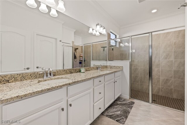 bathroom featuring ornamental molding, an enclosed shower, and vanity