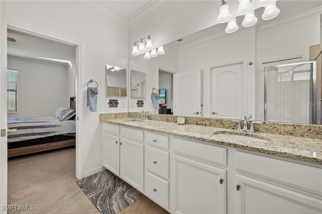 bathroom with vanity, an enclosed shower, tile patterned floors, and ornamental molding