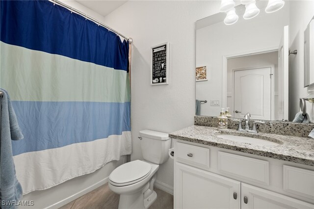 full bathroom with toilet, vanity, and shower / bathtub combination with curtain