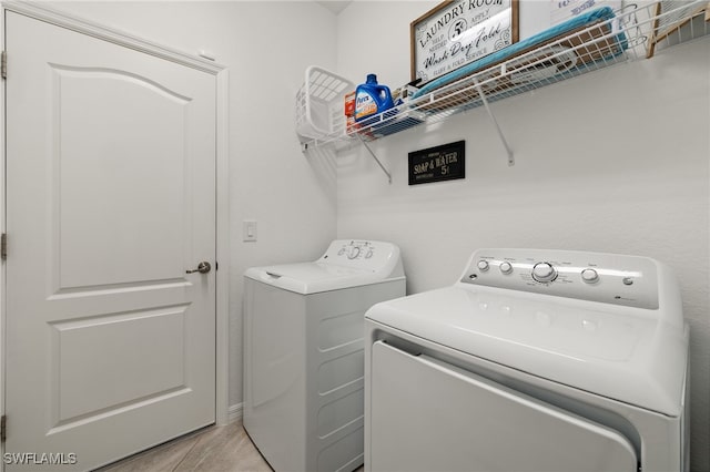 washroom with washer and clothes dryer