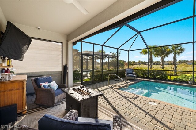 view of pool with a lanai and a patio