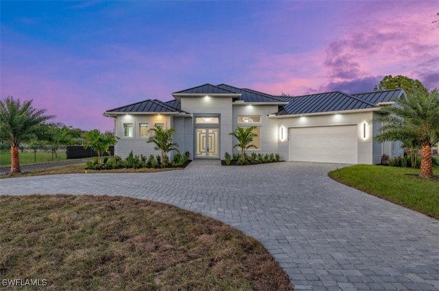 239 20th Ave NE, Naples, FL 34120 - view of front of home with a garage and a lawn