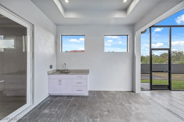 bathroom featuring vanity and a tray ceiling