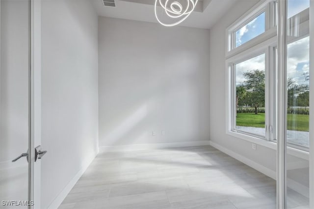 spare room featuring plenty of natural light