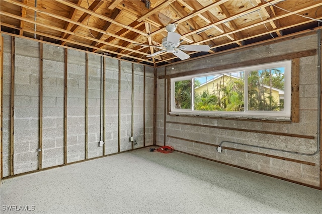 basement featuring ceiling fan