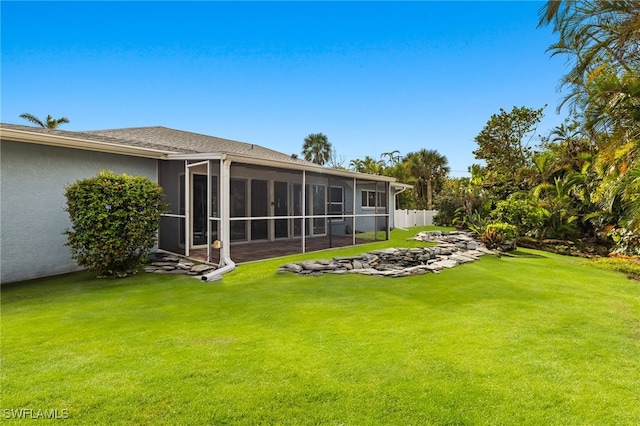 view of yard with a sunroom