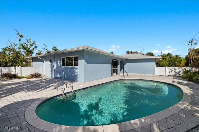 view of swimming pool with a patio area