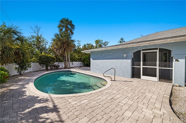 view of swimming pool with a patio