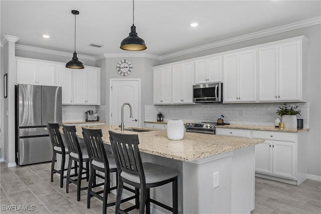 kitchen featuring a sink, appliances with stainless steel finishes, crown molding, and white cabinetry