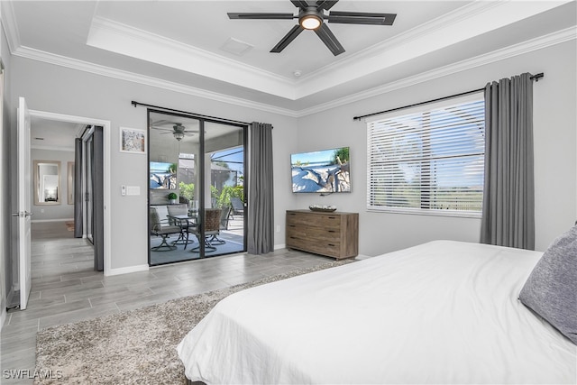 bedroom featuring ceiling fan, light wood-type flooring, ornamental molding, and access to outside