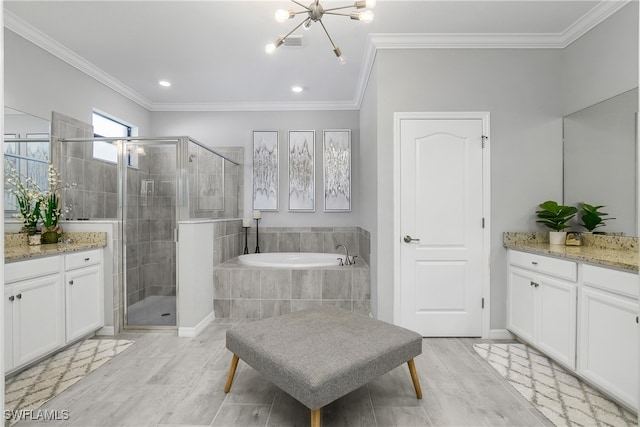 bathroom with vanity, crown molding, and plus walk in shower