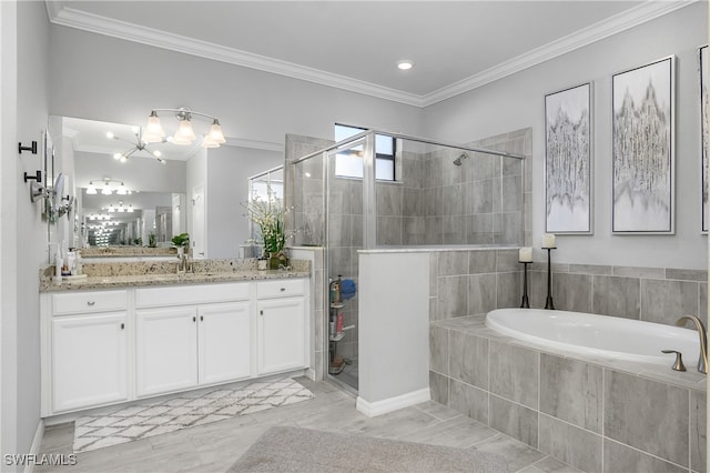 bathroom with vanity, independent shower and bath, and crown molding