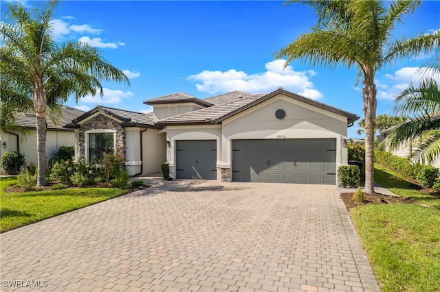 view of front of house with a front lawn and a garage