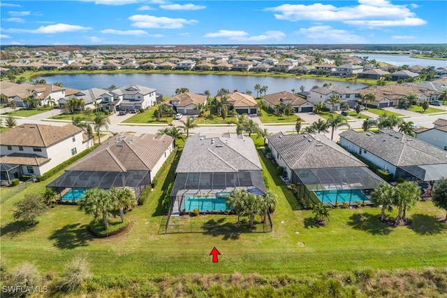 birds eye view of property with a water view