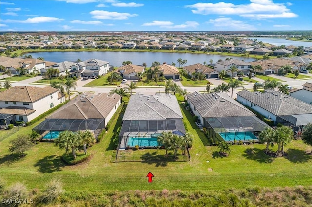 aerial view with a residential view and a water view