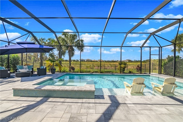 view of pool with outdoor lounge area, glass enclosure, a patio area, and a pool with connected hot tub