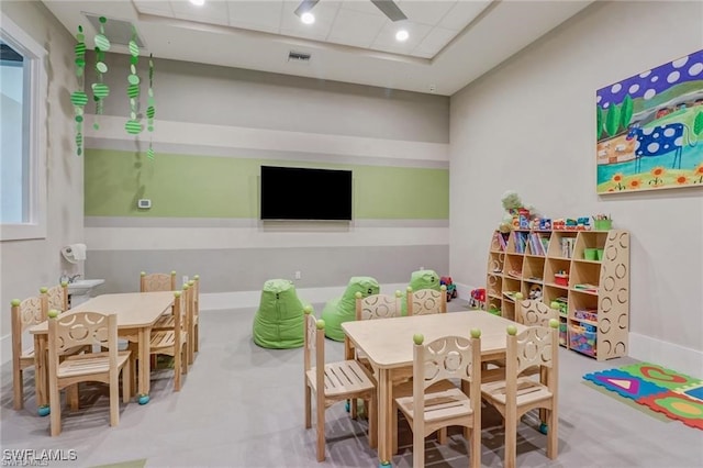 playroom featuring baseboards, visible vents, and a drop ceiling