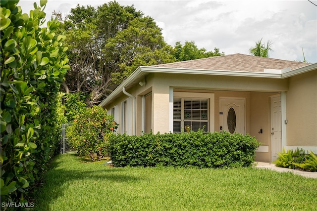 view of side of home featuring a yard