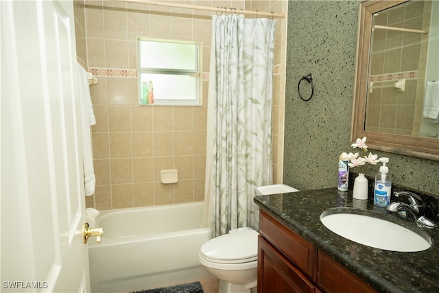 full bathroom featuring vanity, shower / bath combo, and toilet