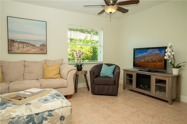 tiled living room with ceiling fan