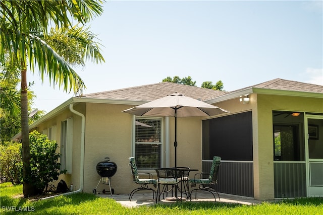 back of house with a patio area